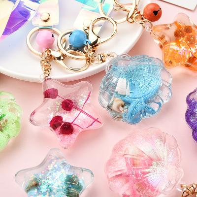 China Huajing Promotional Gift Souvenir Custom Acrylic Starfish Shell Shaped Glitter Liquid Key Chain for sale