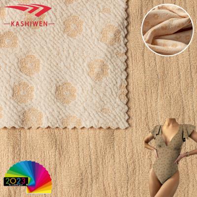 China 2023 simple new style small flower knitted jacquard fabric polyester nylon Spandex jacquard fabric soft swimsuit bikini for sale