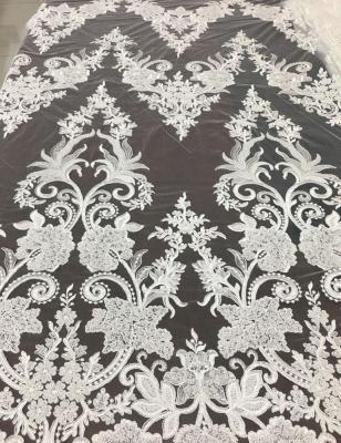 China High Quality Shrink-Resistant Machine Beaded Embroidered Bridal Lace Fabric Luxury Embroidery Beads Sequins Dress Fabric Stock Lot for sale