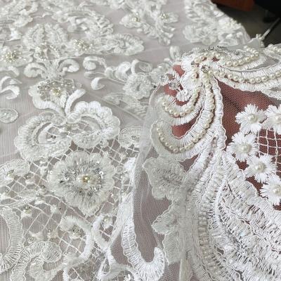 China Luxury Shrink-Resistant Wedding Dress Fabric With Heavy Handwork Beaded Beaded Rhinestones All Over Embroidered Lace Tulle Fabric For Bridal for sale