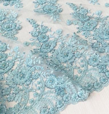 China Beautiful Light Blue Shrink-Resistant Lace Fabric Heavy Hand Beaded Rhinestones Embroidered Lace Fabric For Dress for sale