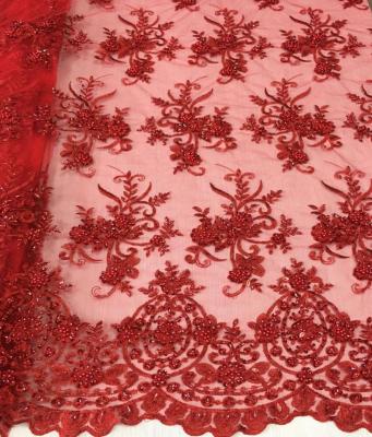 China New style good quality Shrink-resistant red beaded lace fabric/hand embroidery beaded sequin lace fabric textile for bridal dress for sale