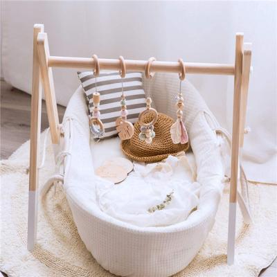 China Toy Foldable Baby Wooden Educational Gym with 4 Wooden Baby Teething Toys Frame Hanging Activity Gym Bar Gift Newborn Baby and Boy Gym for sale