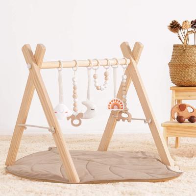 China Educational Toy Montessori Wooden Baby Gym with Hanging Baby Toy Top Play Bar 3 Foldable Activity Gym Frame Baby Toys with Mat for sale