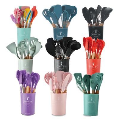 China Amazon Sustainable Hot Sale 12pcs Kitchen Cooking Wooden Handle Silicone Utensils Set for sale