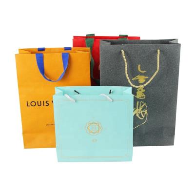 China Recycled Materials Custom Exquisite Shopping Paper Bag Printed Gift Bag Clothing Bag for sale