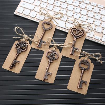 China Creative Retro Metal Bottle Opener Advertising Wedding Gift Key Chain Zinc Alloy Key Pendant for sale