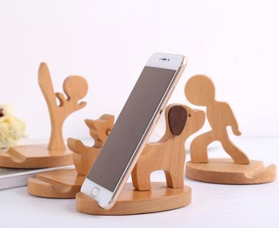 China Custom Logo Solid Wood Remote Control Bedside Mobile Phone Desk Lazy Bracket Mobile Phone Bracket for sale