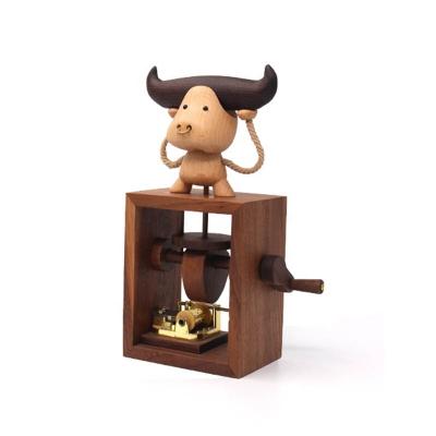 China Fashional Wooden Figurine Bull Music Box with Sky City Valentine Day Birthday Gift for Girlfriend/Boyfriend for sale