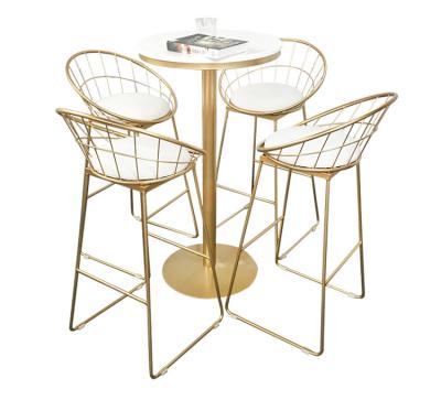 China Unique Light Luxury Design Metal Frame Dining Table And Chairs Set Dining Room Furniture for sale