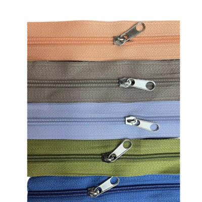 China High Quality Wholesale Nylon Zipper Tape 3# Garment Bag Rolls Auto Lock Long Chain Nylon Zipper Zipper for sale