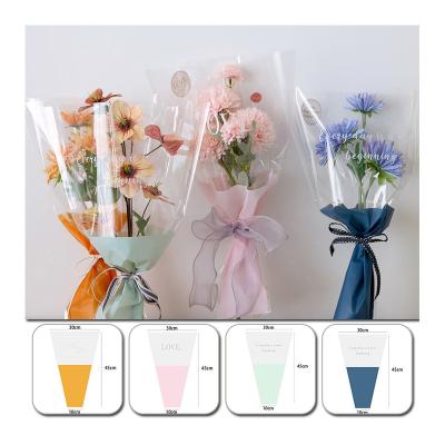 China Daily Packaging Custom Printed Plastic Wrapping Bag Rose Bouquet Gifts Packaging Transparent Cellophane Flowers Sleeves For Wedding Party for sale