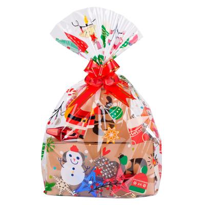 China Daily Packing OPP Christmas Snowflake Hamper Bags 36x 24 inch Large Cellophane Bags with Pull Bows for Hamper and Some Great Christmas Gifts for sale