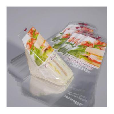 China Disposable Custom Triangle Shape Clear Barket Bag Bread Toast Snacks Sandwiches Disposable Hand Carry Packaging Bags for sale