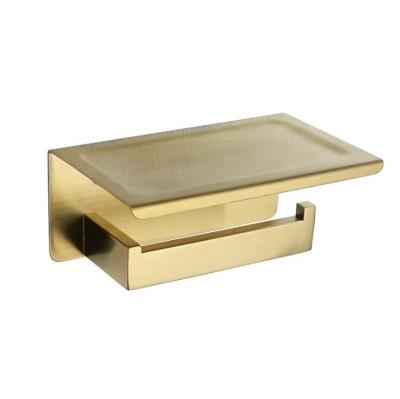 China 304 Stainless Steel User Friendly Storage Bathroom Tissue Holder Gold Wall Mounted Toilet Paper Holder With Mobile Phone Storage Shelf for sale