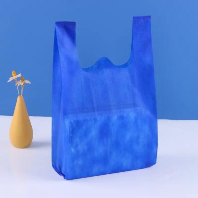 China Eco-friendly Custom PP non woven tnt bags/polypropylene nonwoven t shirt bags bag/t-shirt non-woven vest carrier shopping bag for sale