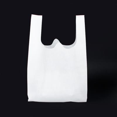 China Eco-friendly Cheap promotion custom logo eco friendly reusable die cut grocery t-shirt bag non woven shopping bag for sale