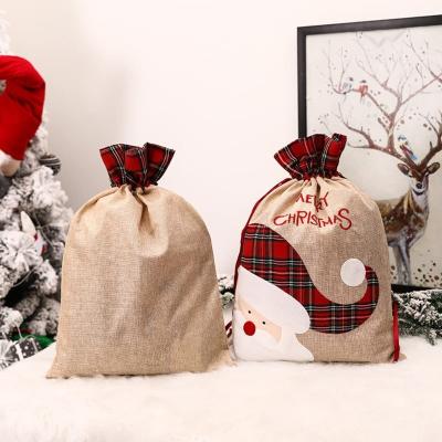 China Eco-friendly Promotional Christmas Decoration Striped Gift Bags With Pom Pom Canvas Drawstring Santa Sack for sale