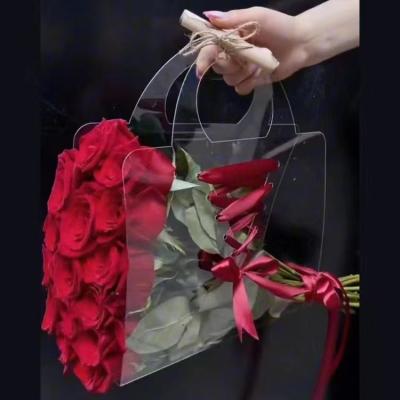 China Recyclable Tiktok Hot Selling 2023 Recycle Eco Friendly Custom Size Transparent Flower Bag Packing Pvc Clear Plastic Flower Bag With Handle for sale