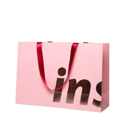 China Recyclable Wholesale Logo Manufacturer Clothing Packaging Pink Custom Gift Package Shopping Paper Bags for sale