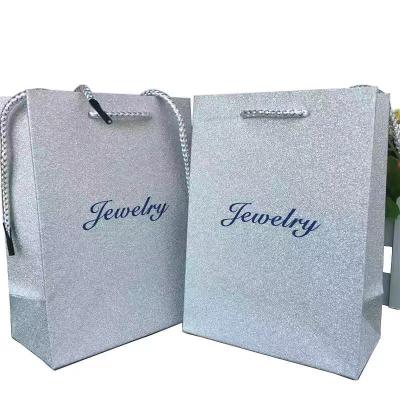 China Luxury Printed Recyclable White Kraft Paper Custom Small Paper Bags With Logo for sale