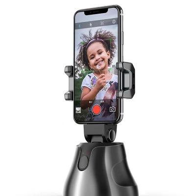 China Newest Styles Portable Selfie Robot Stick 360 AI Video Adjustable Auto Smart Shooting With Camera Phone Holder for sale