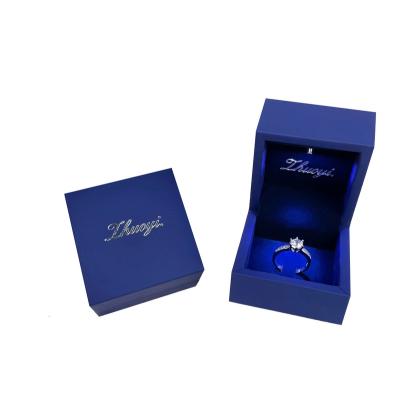 China For customer packaing Jewelry LOGO Luxury Ring Box with velvet hot stamp packaging jewelry box with led light jewelry box for sale