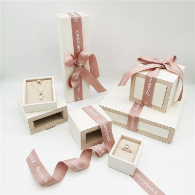 China Elegant Pink Jewelry Packaging Drawer Jewelry Box With Ribbon Jewelry Packaging Ribbon Bow With Customer LOGO for sale