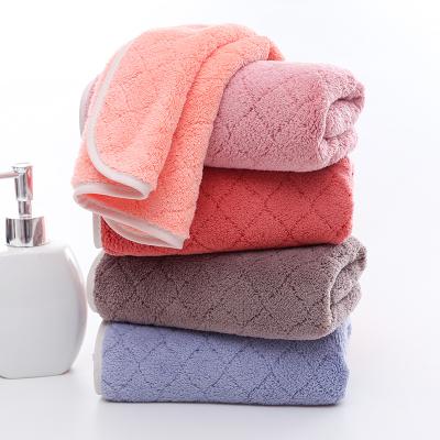 China Sustainable Household High Density Soft Absorbent Wash Towel Thickened Plain Coral Fleece Towel for sale