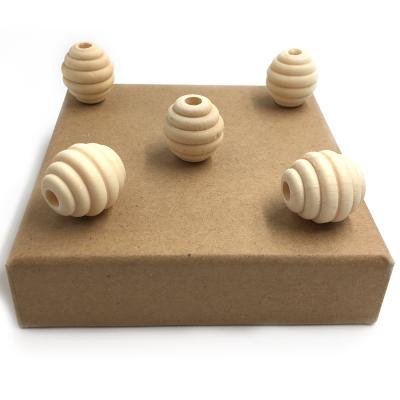 China Eco-Friendly Unfinished Beehive Raw Wooden Round Beads For DIY Wooden Teether Necklace Original Honeycomb Beads for sale