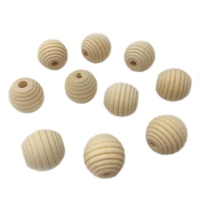 China Eco-Friendly Unfinished Beehive Raw Wooden Round Beads For DIY Wooden Teether Necklace Original Honeycomb Beads for sale