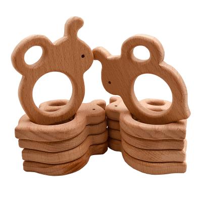 China Custom Made Eco-Friendly Organic Natural Beech Teether Wooden Bee Milk Teeth Wooden Sensory Toys for sale