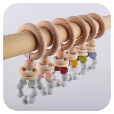 China Soft Toy Beech Wooden Baby Teething Ring Silicone Wooden Beads Bracelet Teething Toy for sale