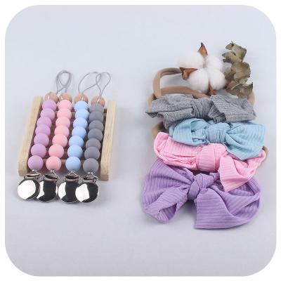 China Soft Toy New Baby Silicone Pacifier Clip Bowknot Headband Set Nursery Dummy Quilt Clips Set for sale