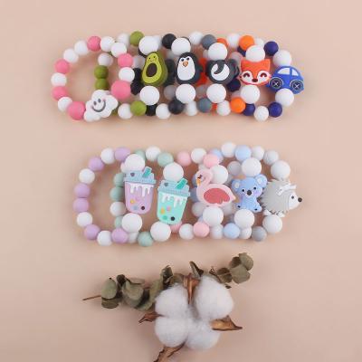 China Toy Safety Rubber Food Grade Soft Silicone Beads Teether Toys Gifts Baby Silicone Wristband for sale