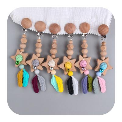 China Toy Christmas Gift Organic Natural Beech Soft Wood Pendant Beads and Hook Beads Silicone Feather Stroller Car Pendant Molar for sale