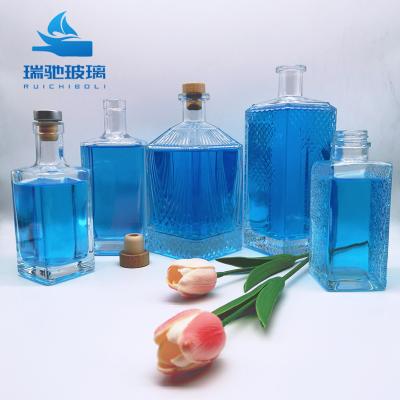 China Transparent Extra Flint Whisky Bottle 700ml 750ml 1L Standard Transparent Glass Bottle for sale