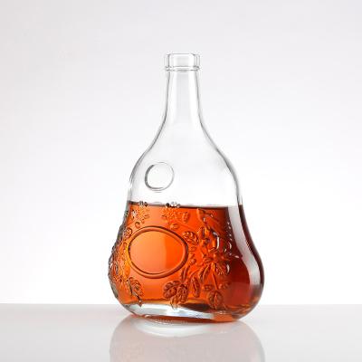 China Stil Super Flint Glasflasche Einzigartige Form Prägner Körper Wodka Brandy Liquor Flasche zu verkaufen