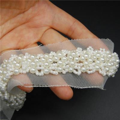 China Viable Wholesale High Quality White Nylon Beaded Embroidery Lace Trim For Wedding Dress for sale