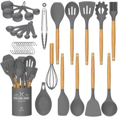 China Sustainable 33pc Kitchen Spatula Set Nonstick Silicone Cookware Kitchen Accessories With Stainless Steel Handle for sale