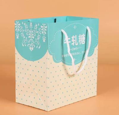 China Custom Luxury Gift Garment Paper Shopping Bags With Logo Print for sale