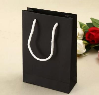 China Custom Luxury Gift Garment Paper Shopping Bags With Logo Print for sale