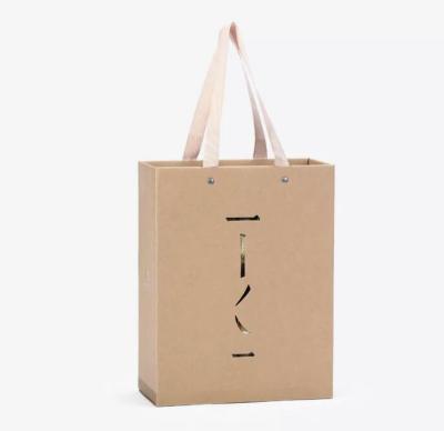 China Custom Luxury Gift Garment Paper Shopping Bags With Logo Print for sale