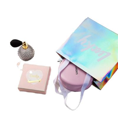 China Luxury Recycled Materials Custom Printing Popular Creative Cosmetic Clothes Packing Color Holographic Paper Shopping Bag for sale