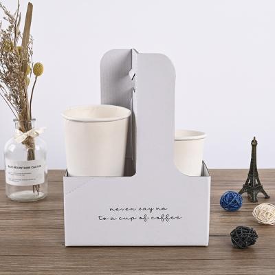 China Custom Logo Printed Eco Friendly Disposable Take Out Coffee Paper Cup Holder With Hands for sale