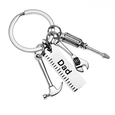 China Metal Latest Father's Day stainless steel screwdriver axe husband car pendant Dad keychain for sale