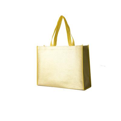 China Recyclable Glitter Shiny Nonwoven Bag With Handles PP Material Die Cut Vest T-shirt Nonwoven Bag for sale