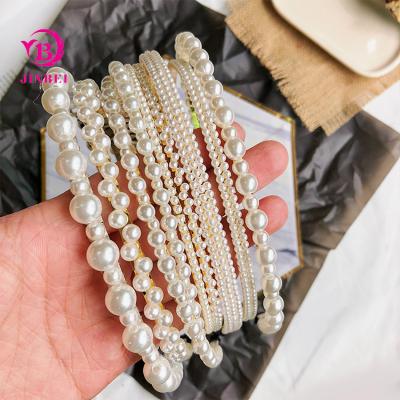 China Stylish Hair Decoration Fashion Headband Latest Designs Girls Pearl Head Bands Pearl Headband For Women for sale