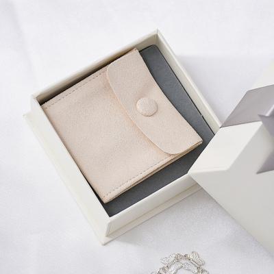 China Custom Jewellry Logo Jewelry Package Ivory Microfiber Snap Button Gift Packaging Bag With Insert Pad Jewelery Pouch for sale