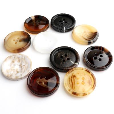 China Durable in stock eco-friendly resin round button and custom black 4 holes horn buttons for sale